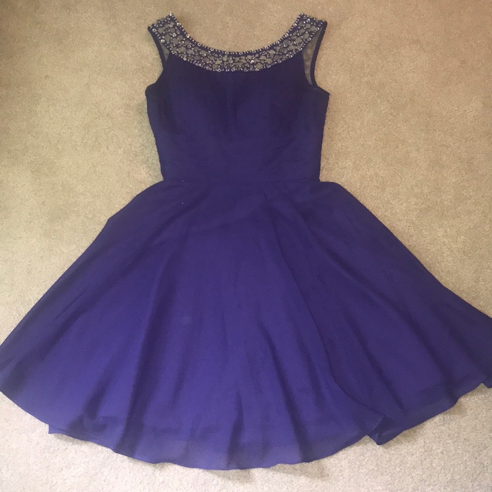 Purple jeweled dress.
